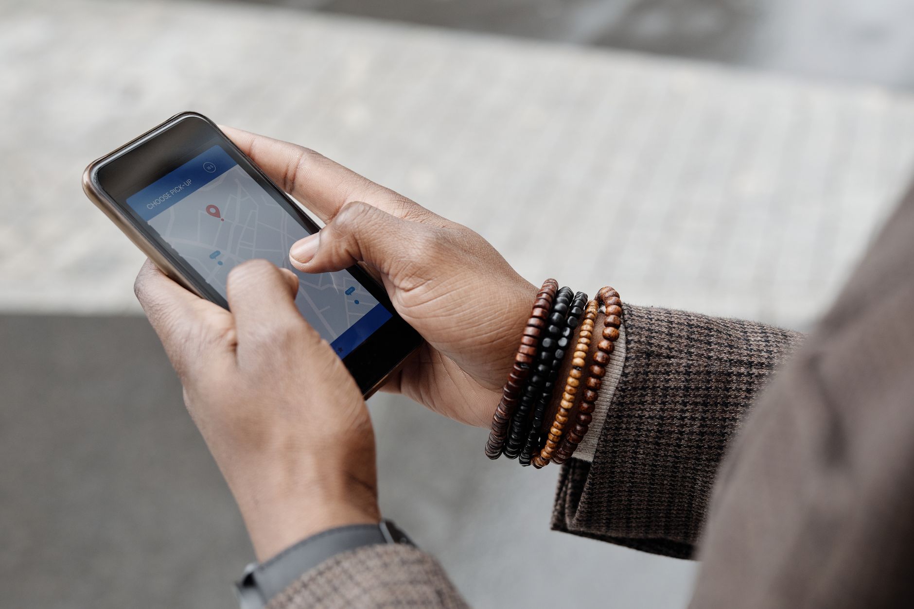 Person holding a smartphone showing a colorful Gemini AI assistant screen